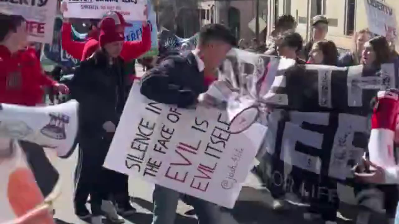 Protestor with trans flag assaults some of our StudentsforLife