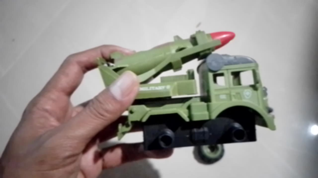 playing kid's military rocket truck