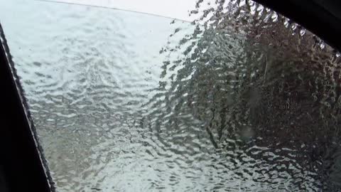 Ice storm. Smashing the car window.