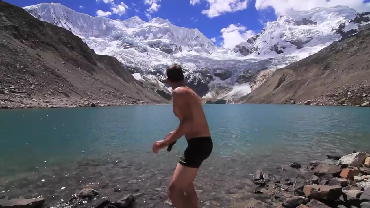 ‪idiot jumps in dangerous peruvian glacial lake causes avalanche‬