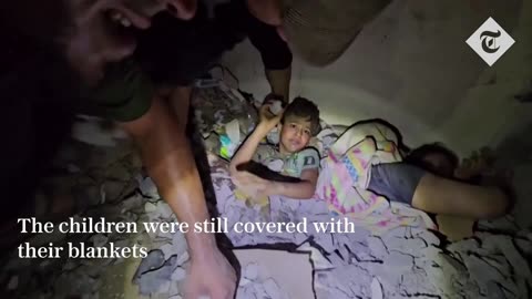 Palestinian child is dug out from beneath rubble following airstrike