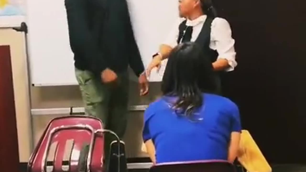 Transgender man pushes a woman