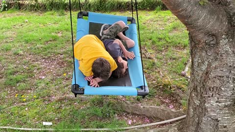 The boys swinging