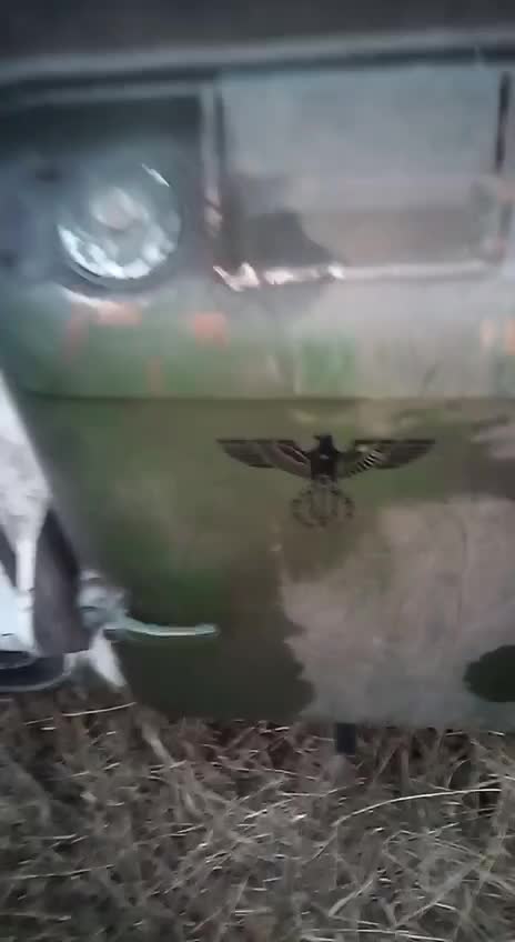 A Ukrainian tank decorated with a III Reich Nazi eagle...