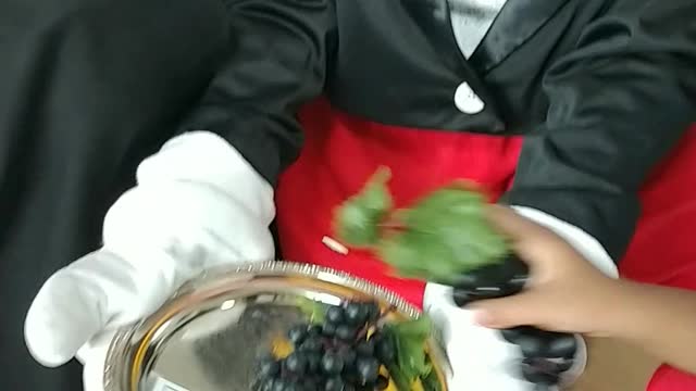 Houston mascot party character mouse Mickey shops for fruit at birthday event in Richmond, Texas
