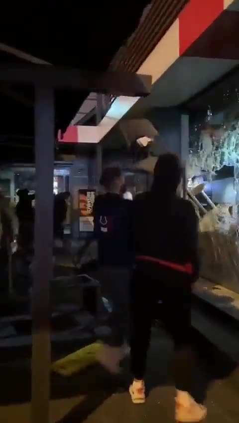Protesters vandalize a McDonald's restaurant due to the Israel-Palestine conflict