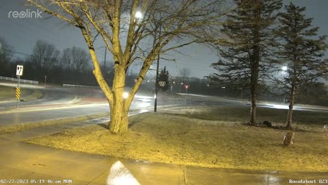 Driver Loses Control Entering Roundabout on Slick Streets