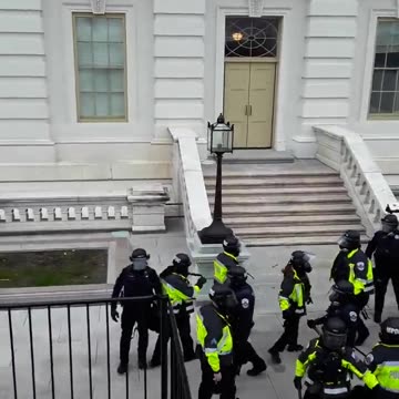 DC cops retreat from position on upper west terrace around 2:30 on January 6.