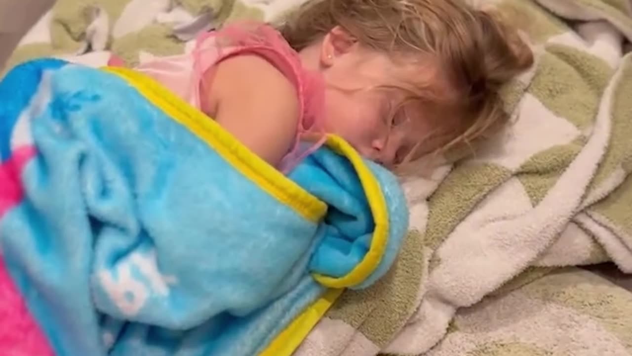 Mom discovers her toddler asleep on bathroom floor for the sweetest reason