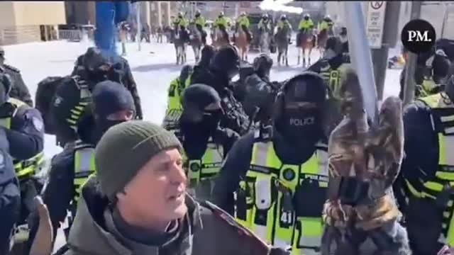 Officer in Ottawa beats protester with gun🇨🇦 #saveCanada