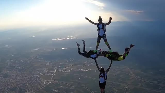 Four Men Make Cool Formation in Air While Sky Diving