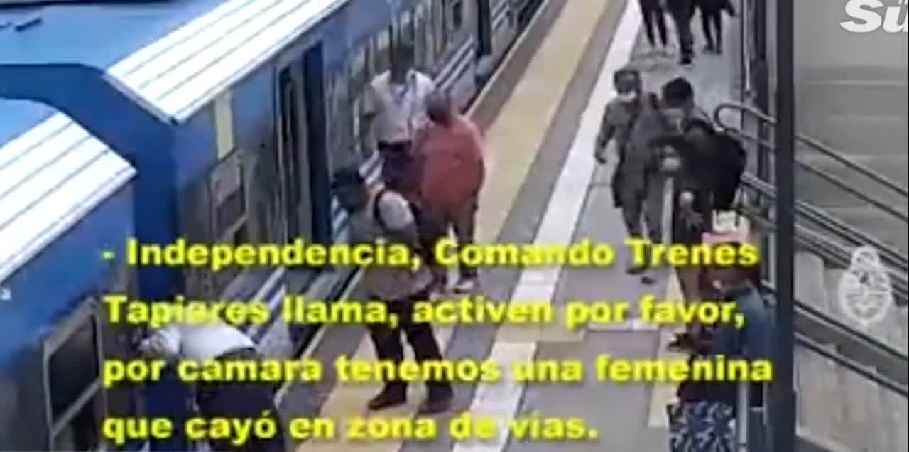 WOMAN FAINTS AND FALLS ON THE TRACK LINE WITH THE TRAIN RUNNING AND SHE SURVIVES