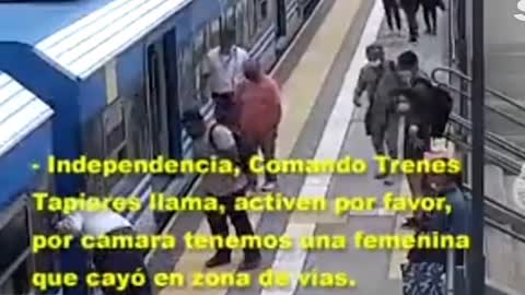 WOMAN FAINTS AND FALLS ON THE TRACK LINE WITH THE TRAIN RUNNING AND SHE SURVIVES