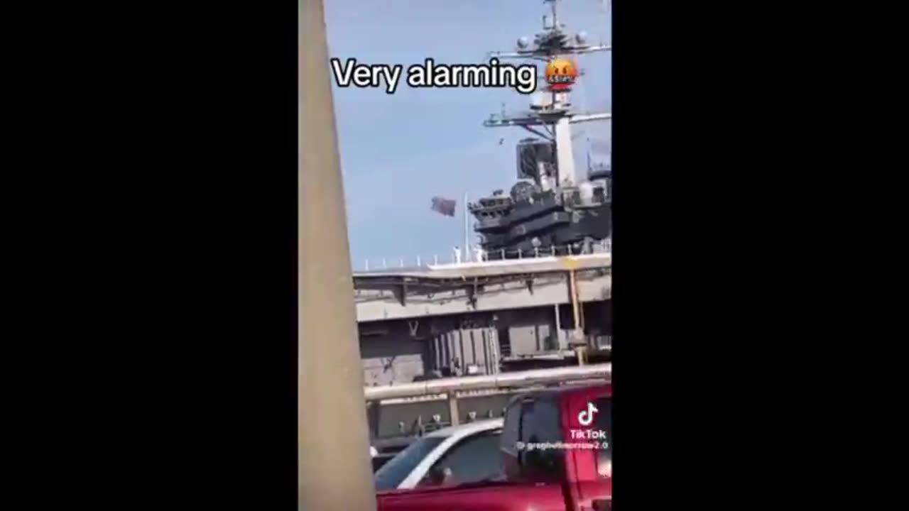 US NAVY FLIES DISTRESS FLAG FROM DOCK