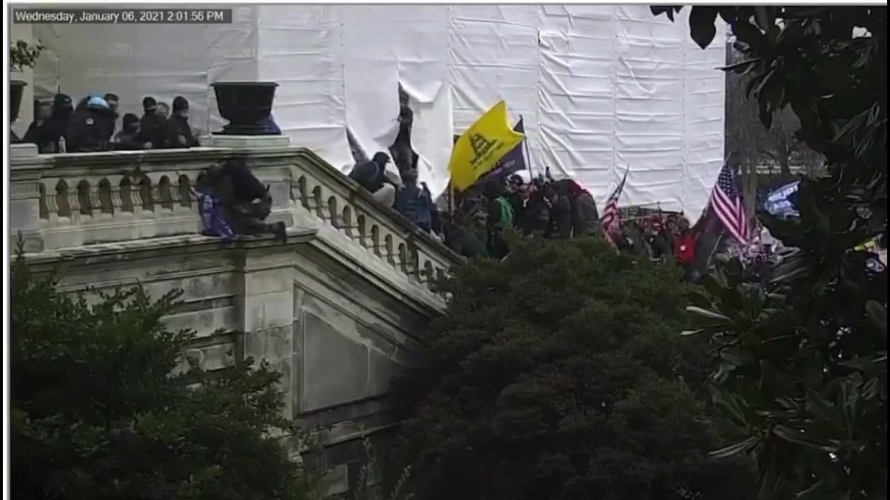 Just a police officer pushing a peaceful J6 protestor off a ledge potentially to his death