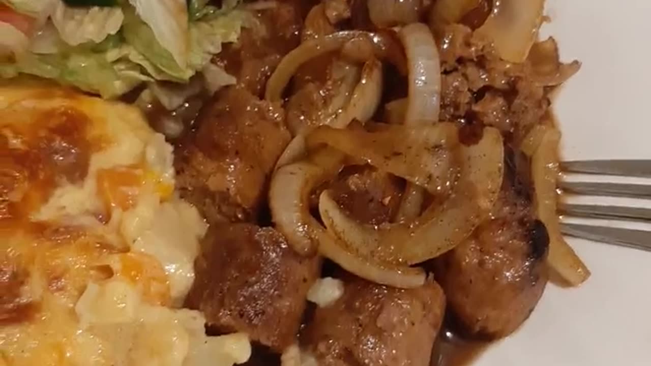 Spicy steak with scalloped potato and salad delish