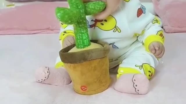 Cute baby reaction on new toy