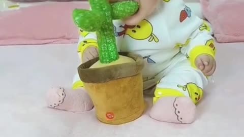 Cute baby reaction on new toy