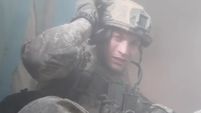 A Ukrainian soldier in Bakhmut during shelling.