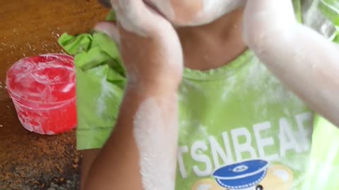 daughter playing with powder on her face