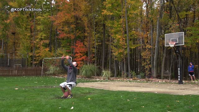 Impressive backflip basketball trick shot