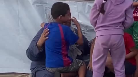 Palestinian grandmother embraces her grandchildren after they SURVIVED an ISRAELI BOMBING