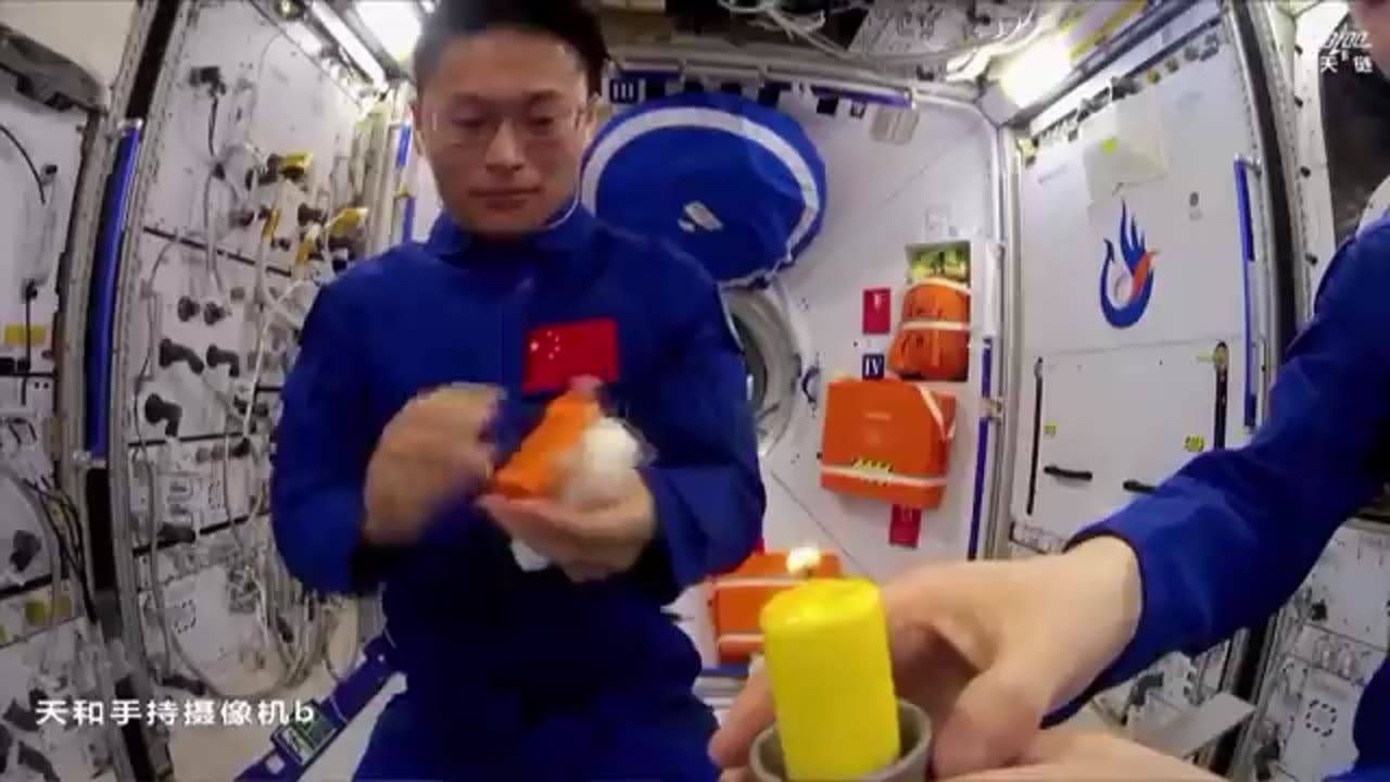 Chinese astronauts light candle with match on Tiangong space station to show flame behavior