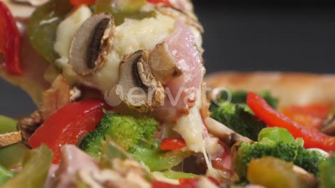 Close Up of a Slice of Pizza with Mushrooms Cheese Broccoli Pepper