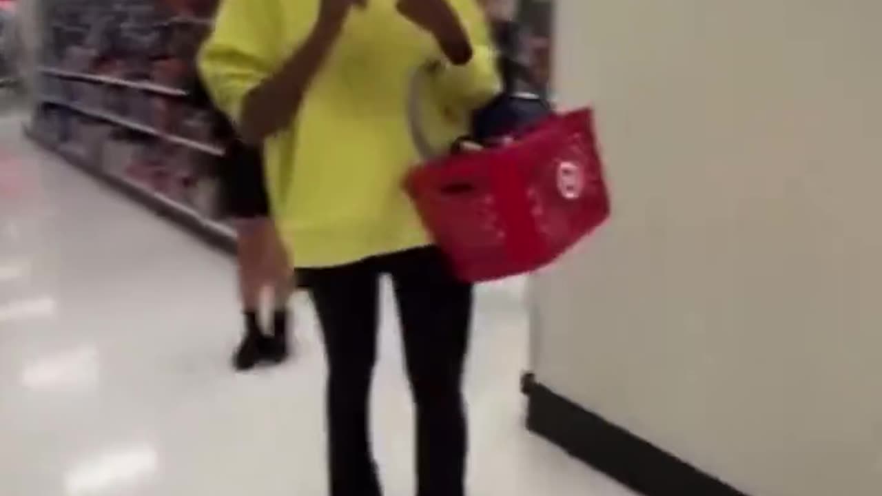 Big Mike AkA "Michelle Obama" goes shopping unnoticed in a St. Louis Target store.