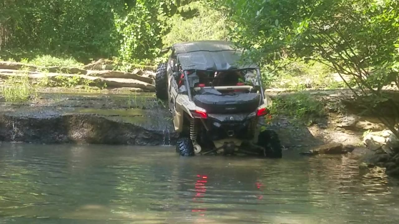 Can-Am climbing a steep ledge