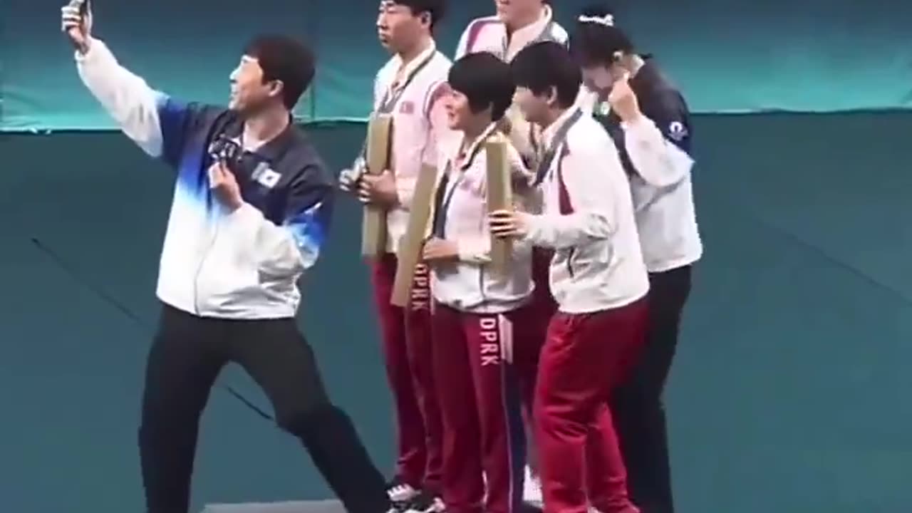 North and South Korean athletes take a selfie together at the Olympics