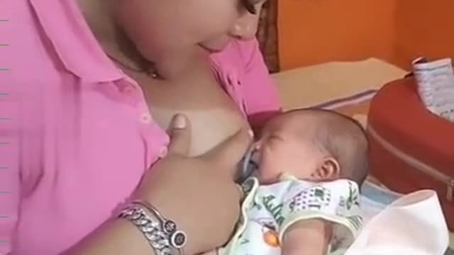 mother is breastfeeding her child