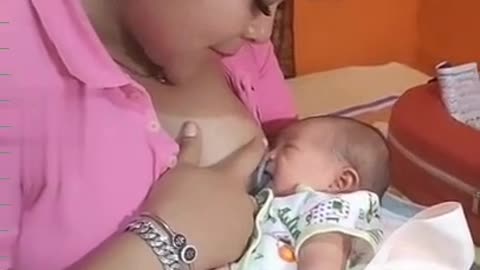 mother is breastfeeding her child