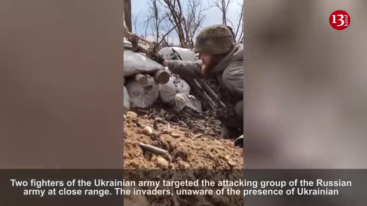 2 Ukrainian fighters fire machine guns and grenades at the approaching Russian attack group