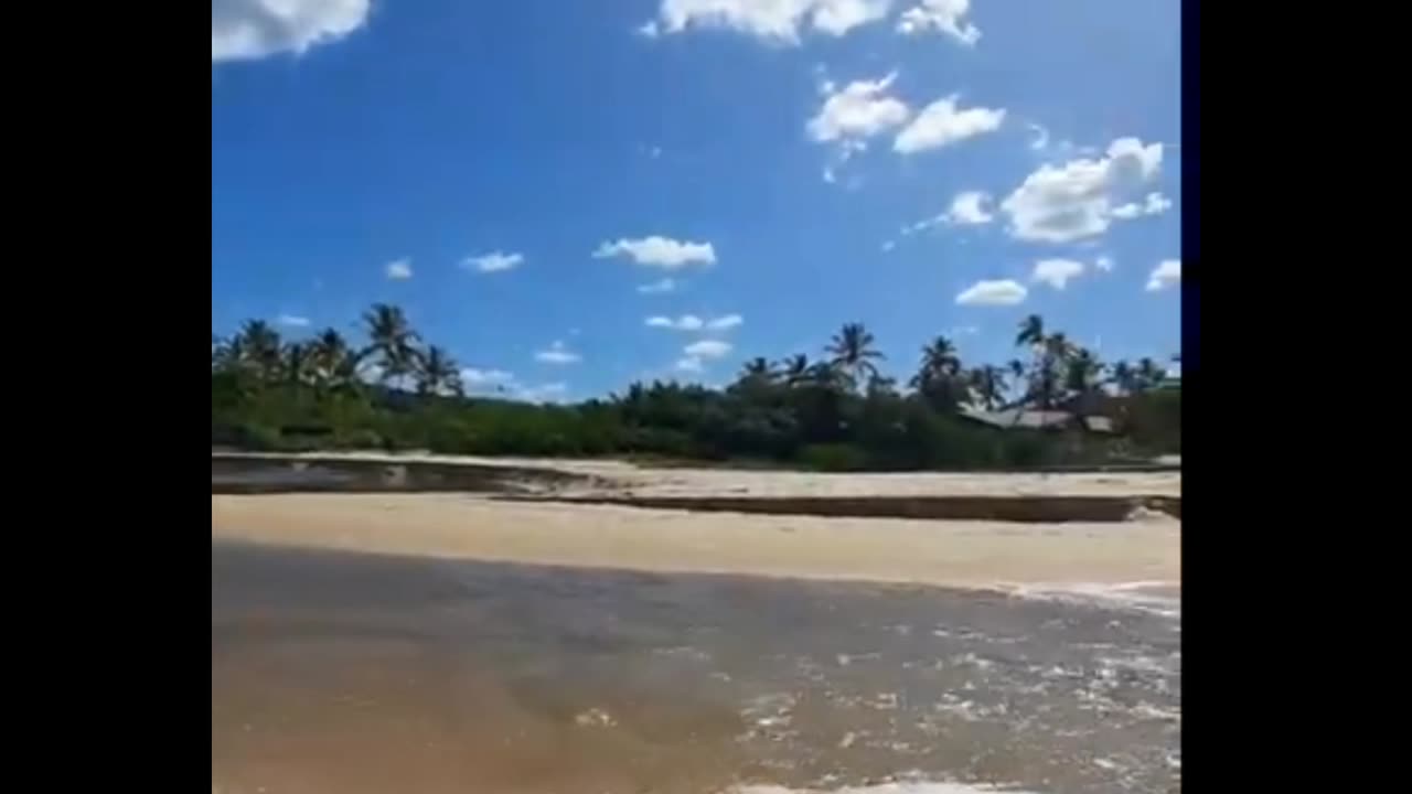 meeting of Rio with the Sea at Foz do Rio da Barra, Brazil