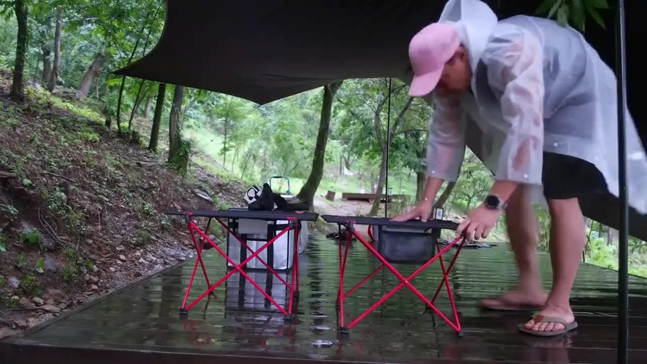 Camping in the rain, enjoying outdoor food alone