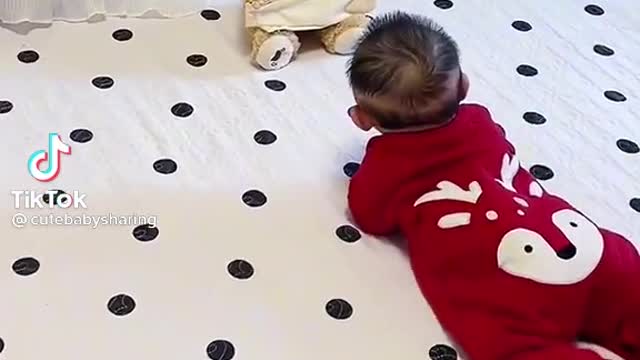 Baby playing with bears