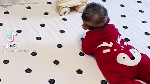 Baby playing with bears