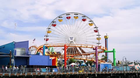 People Going in out Of The Amusement park