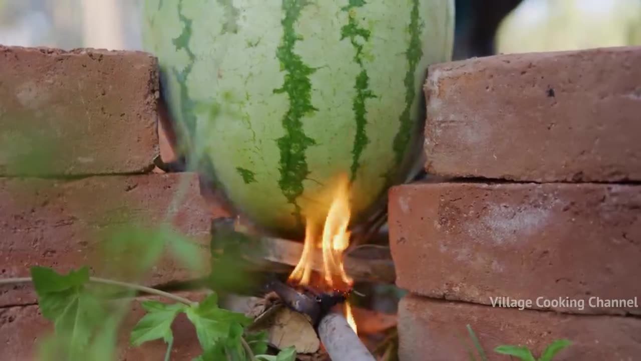 Watermelon chicken cooked in watermelon fruits country chicken gravy in watermelon