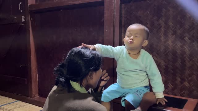 Child Imitates the Priest Praying