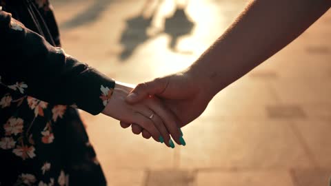 Couple holding hands in a walk