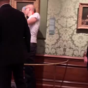 Woke Activist Glues His Head To Priceless Piece Of Art To Save The World From Climate Change