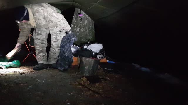 Making a coffee and tidying up under a tarp. Dartmoor. 15th Dec 2022