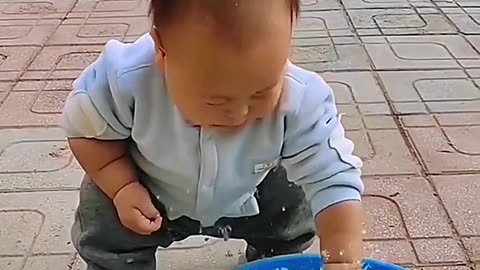 Child with playing fish