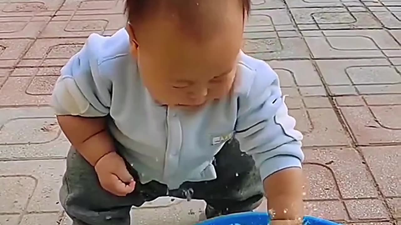 Child with playing fish