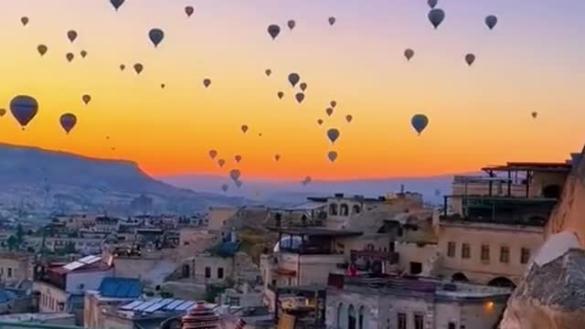 Wow, a lot of hot air balloons are flying together