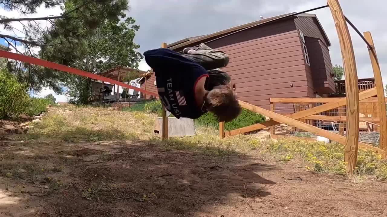 Guy Hits His Head When He Tries To Flip Off A Slackline