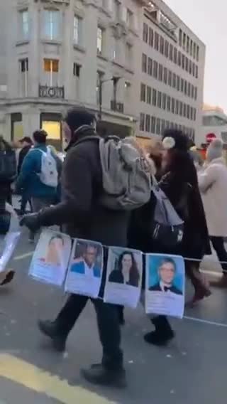 A trail of photographs of just a tiny fraction of those lost to the jab, carried by the crowd en route through central London to Downing Street.