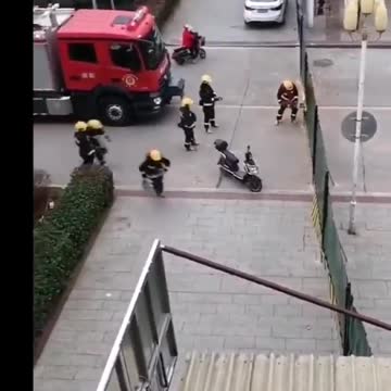 Firefighters cut down Covid barriers in China